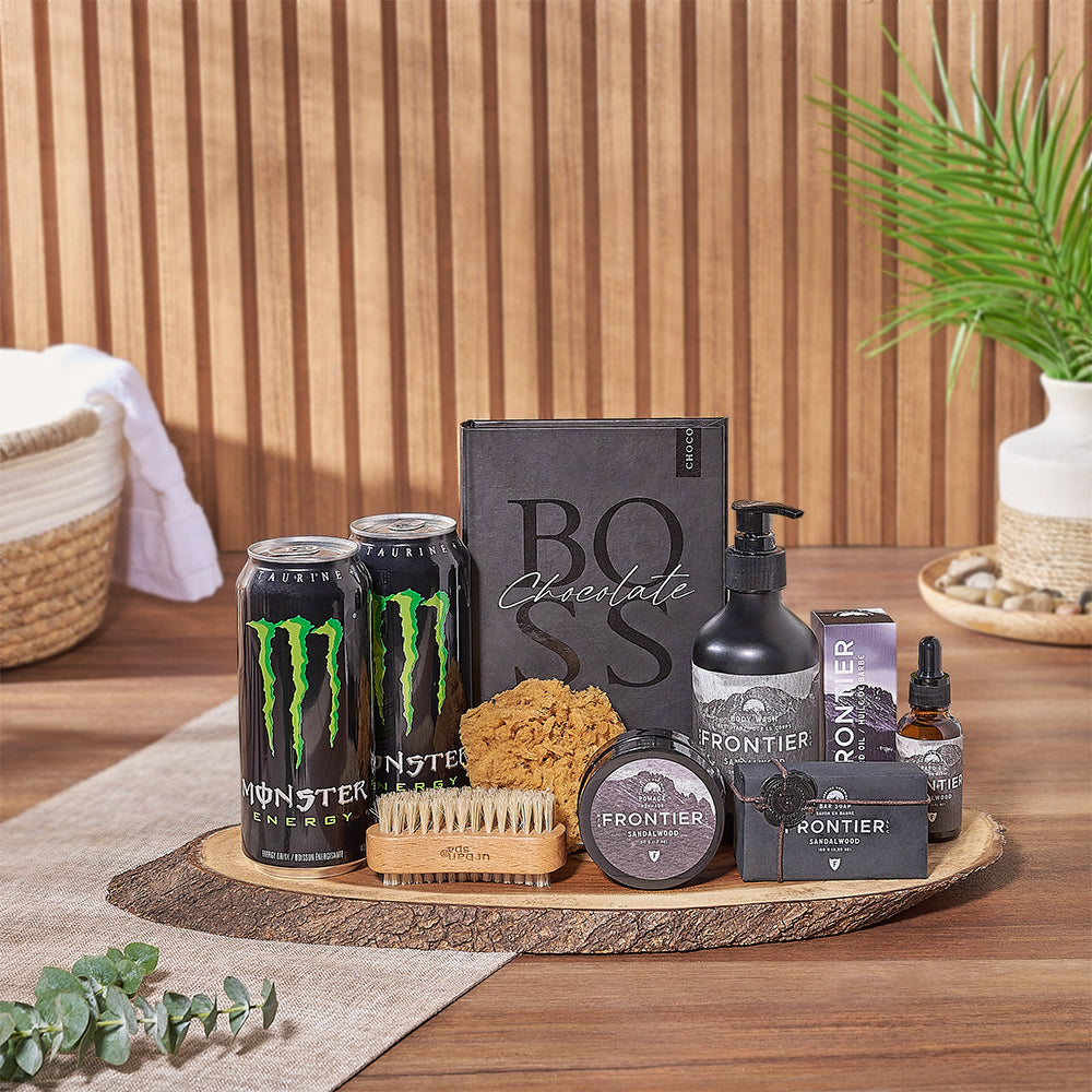 With the Revitalizing Sandalwood Spa Gift, enjoy two Monster energy drinks, a box of dark chocolate bars, a sea sponge, a nail brush, sandalwood scented beard oil, body wash, bar soap, hair pomade, and a live-edge serving board, Ottawa delivery