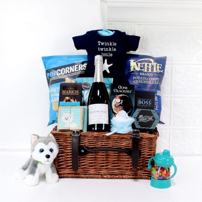 Elegant Champagne Gift Featuring Wicker Picnic Basket and Baby Celebration Items – how the gift is presented