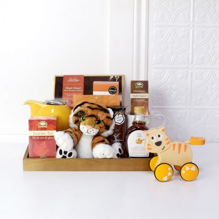 Sweet Little Gestures Baby Gift Basket. Dante Push & Go, Plush Floppy Friends Tiger, True Icewine Black Tea, White Coffee Mug, 100% Pure Maple Syrup, Wild Flower Honey, Hand Made Salted Caramel, Maple Liqueur Chocolats, Maple Grazed Wild Smoked Salmon, Shorts Salted Butterscotch, Dark Wood Tray, Ceramic Teapot with Stainless Steel Infuser. Baby Gifts from Ottawa Baskets - Same Day Ottawa Delivery.